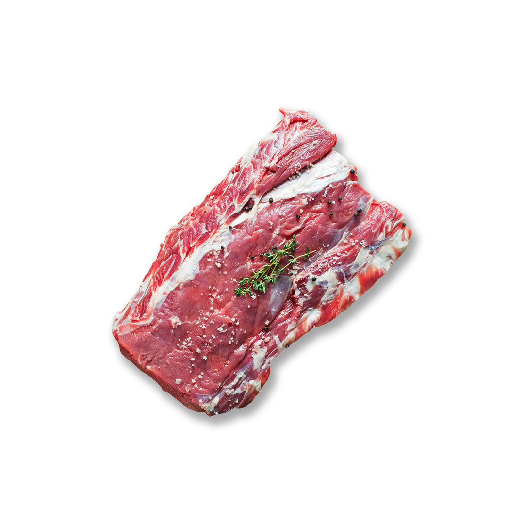 Whole Kentucky grass-fed Rose Veal brisket seasoned with coarse salt and fresh thyme, ideal for smoking, roasting, or braising.