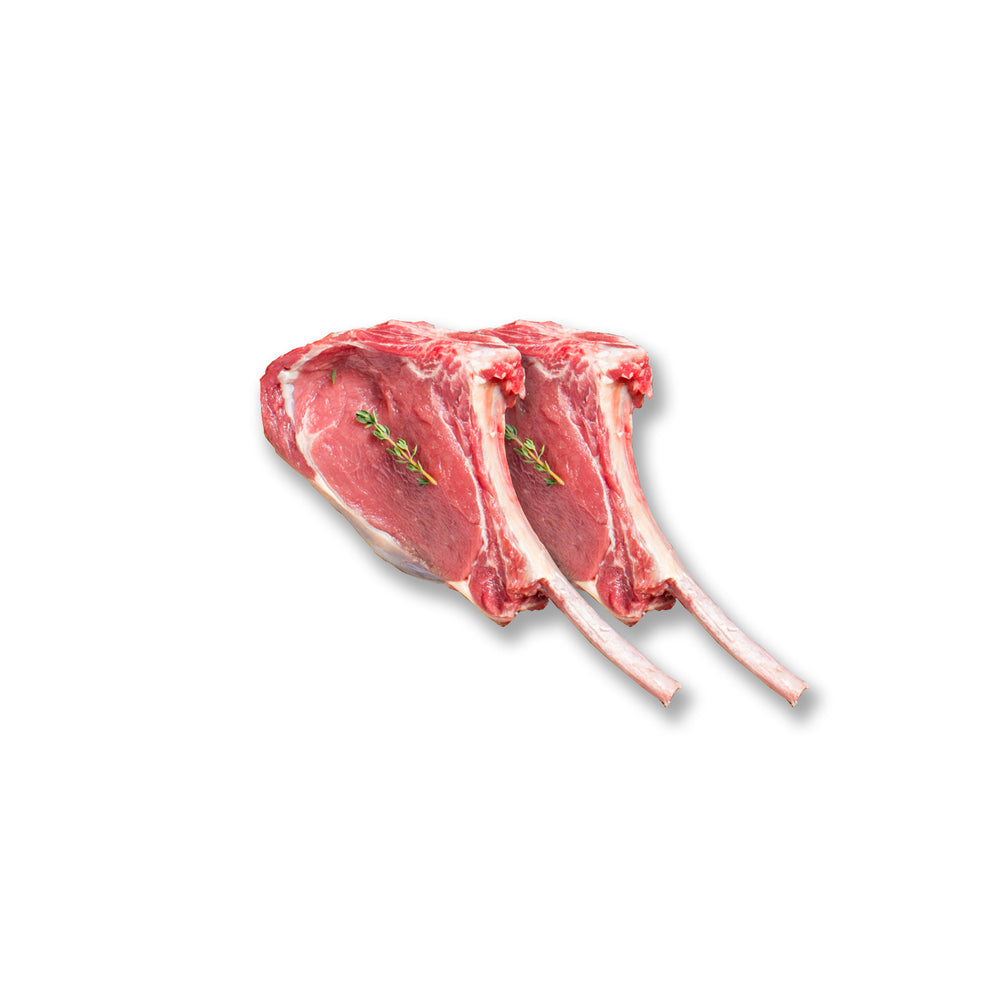 Two-pack of Kentucky grass-fed Rose Veal ribeye steaks with visible marbling and fresh thyme, ideal for pan-searing or grilling.